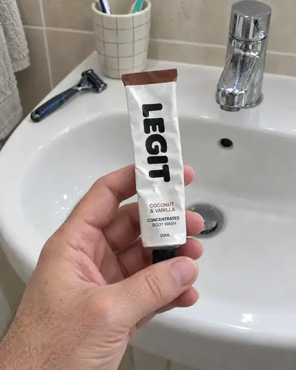 Neil's view of a tube of Legit in his hand over the bathroom sink