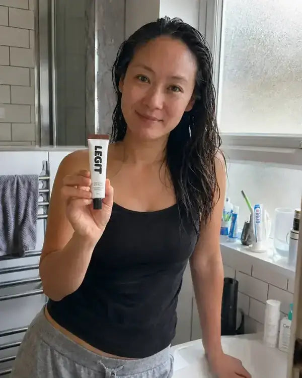 Grace holding a tube of Legit
