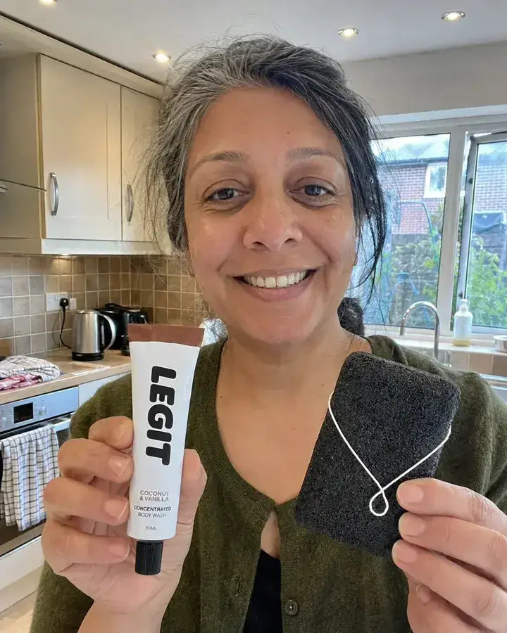 Priya holding a tube of Legit