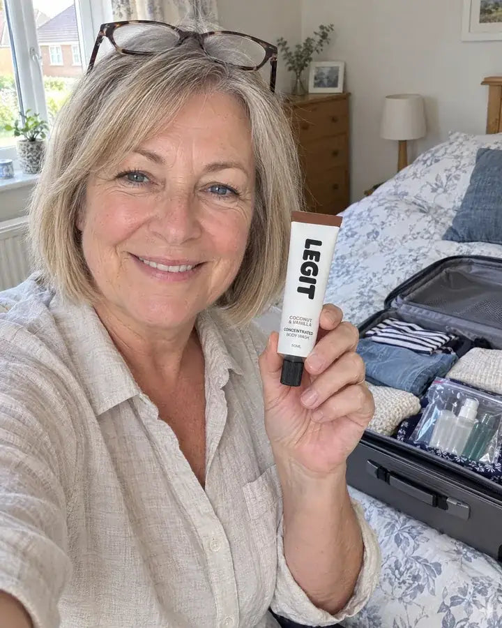 Denise holding a tube of Legit
