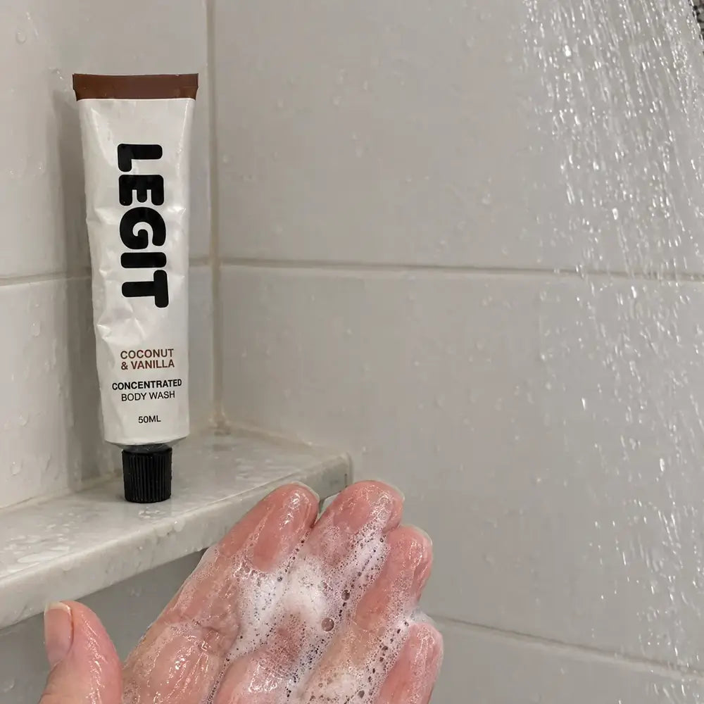 A rich lather in a hand under the shower