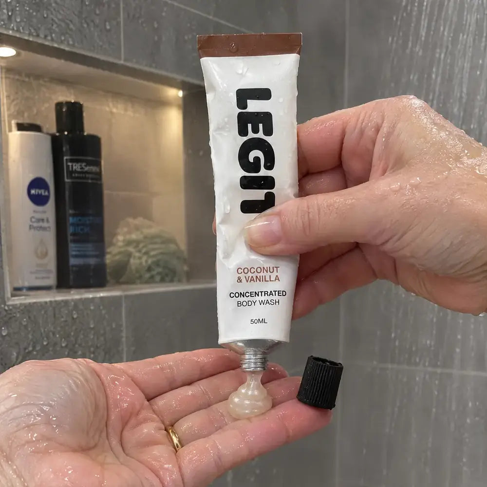 A pea-sized squeeze of body wash into a palm in the shower